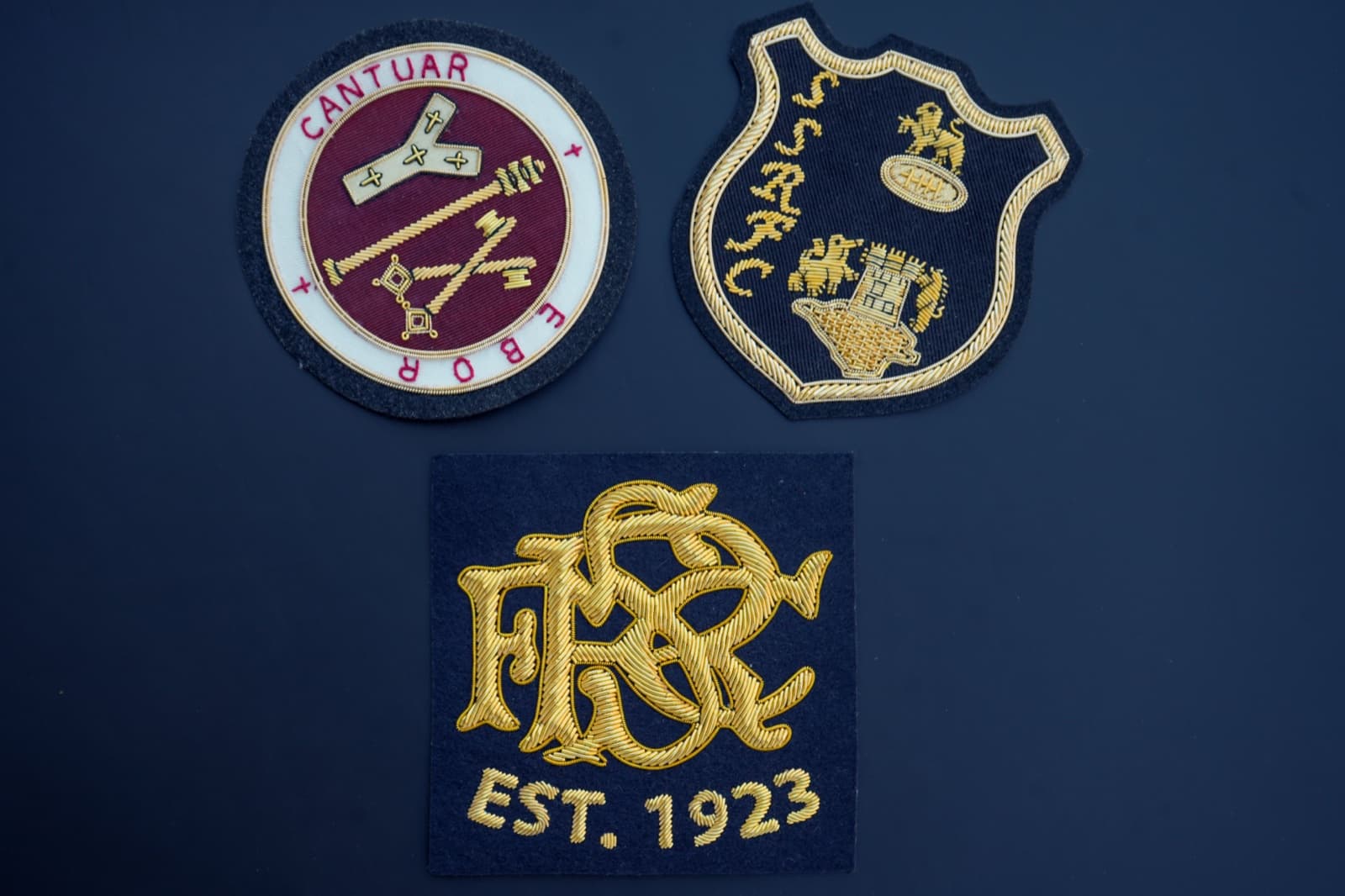 Bullion patch with gold and silver metallic wire embroidery on navy felt