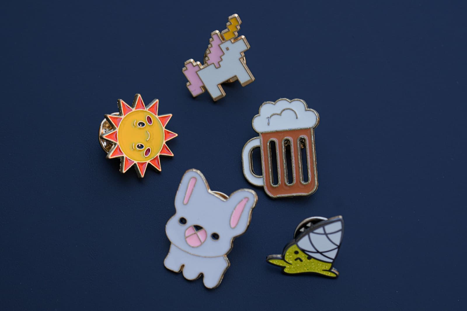 Hard enamel lapel pin with glossy enamel fill and gold-plated metal outlines